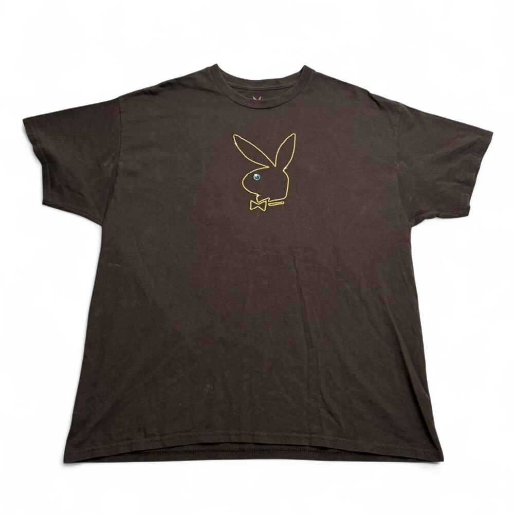 Brown Playboy tee with yellow accents, featuring a unique graphic on the front